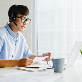Person taking a work call while working from home.