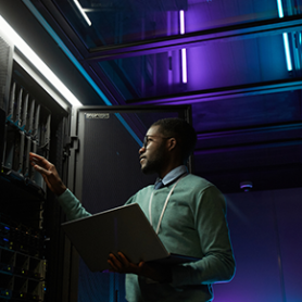 Person standing in front of a server.