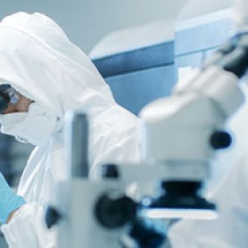 pharma researchers with microscope